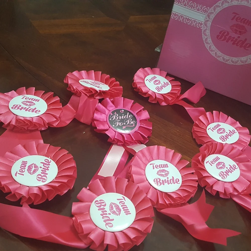 Team bride. Cups and lapel pins.